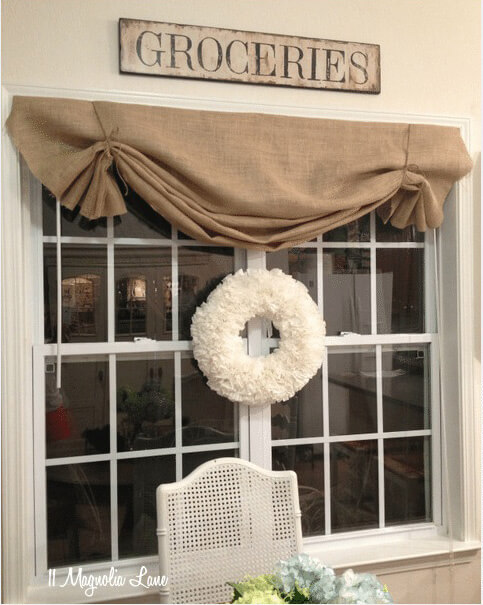 a burlap window valance on a window.