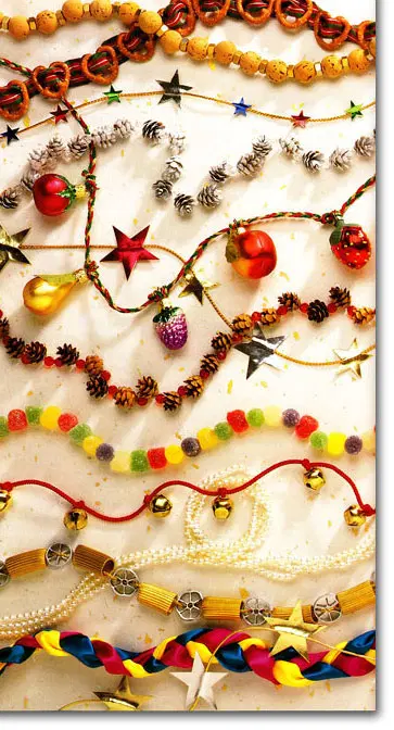 looking down on finished Christmas tree garlands made with gun drops, beads, and jingle bells