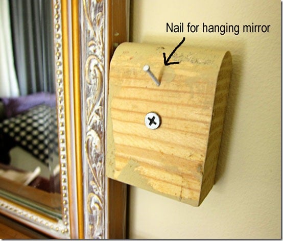 block with nail to easily hang mirrors
