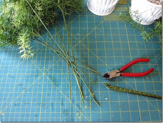 How to cut fake greenery to shape into a topiary.