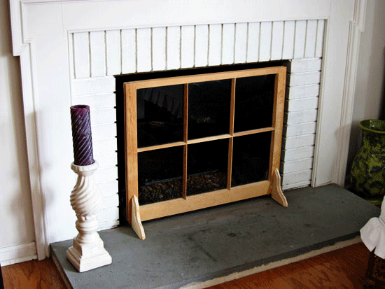How to use a mullioned window sash to make a decorative fireplace screen.