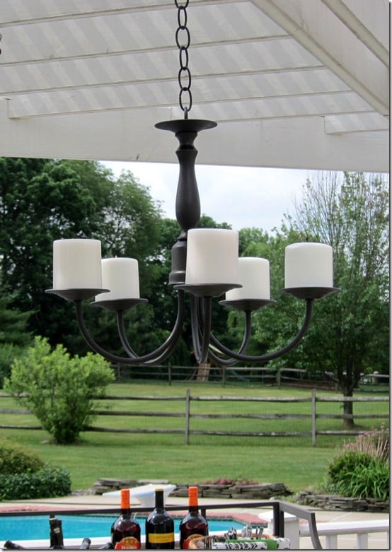 How to make an outdoor candle chandelier using a thrift store light. Step-by-step photo tutorial will show you how easy it is. 