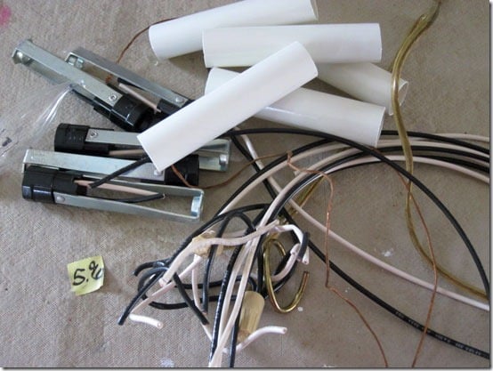 Chandelier taken apart to turn into an outdoor light.