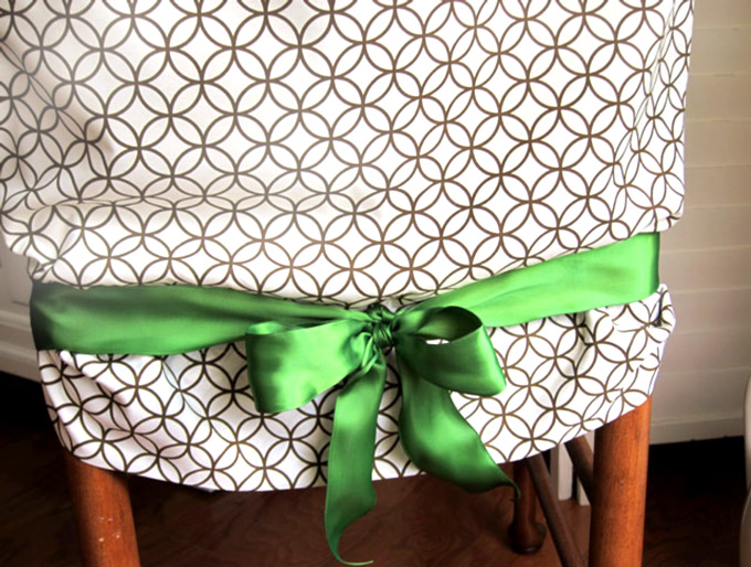 dining-room chair covered with a pillowcse