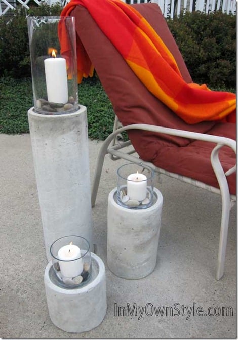 Trio-of-DIY-Restoration-Hardware concrete candle columns for outdoors.