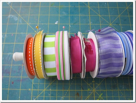rolls of colorful ribbon on a tension rod