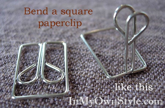how to open an owl style paper clip to use as a card holder.