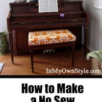 Completed no sew orange and white piano bench cushion cover.
