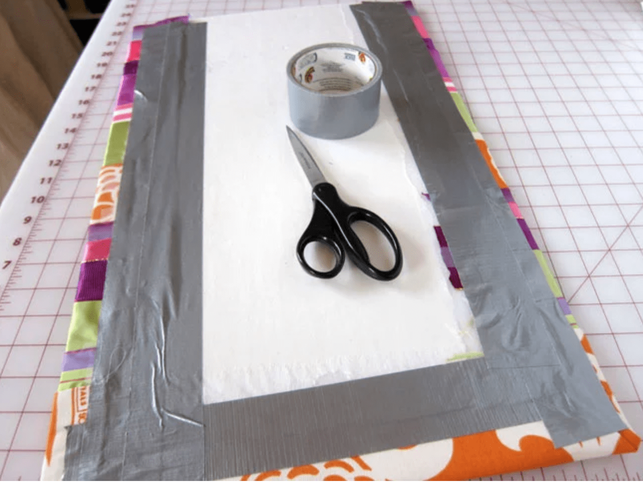 add duct tape to back of ribbon covered board