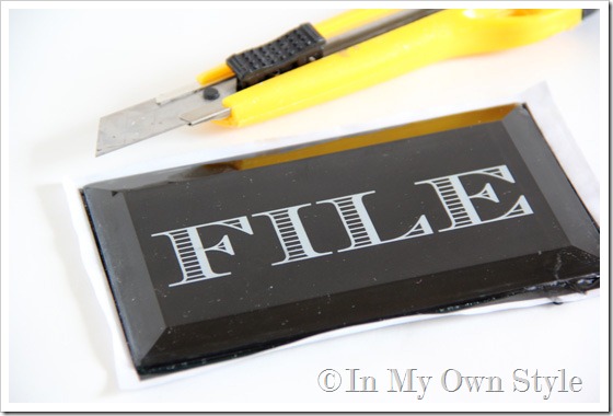 cut excess paper to fit glass for paperweight