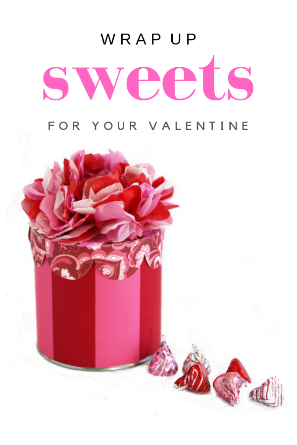 Red and Pink striped round gift box with tissue paper flower top to place a Valentine's Day gift it or candy.