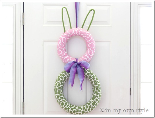 Pink and green fabric bunny wreath for a door.