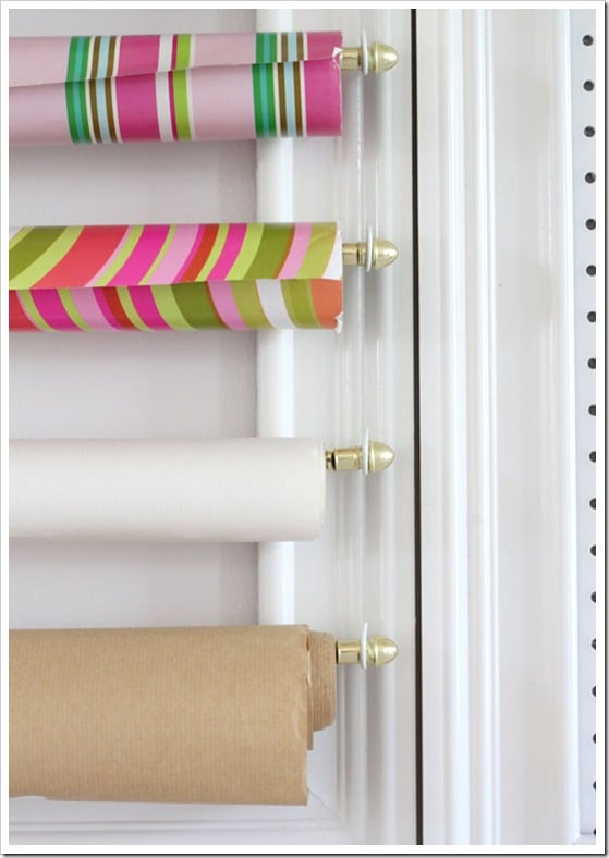 Close-up-of-gift-wrap-frame on a creative wall with 3 rolls of gift wrap.