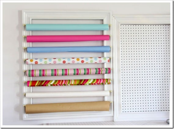 Gift-wrap organizer on wall.