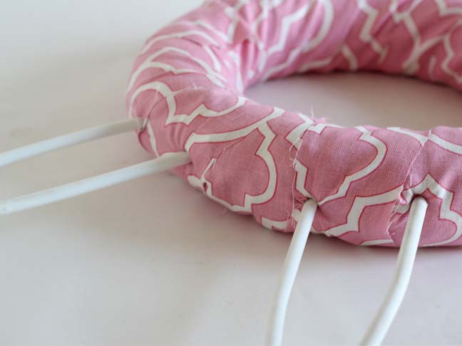 How to make ears on a bunny wreath using plastic hangers.