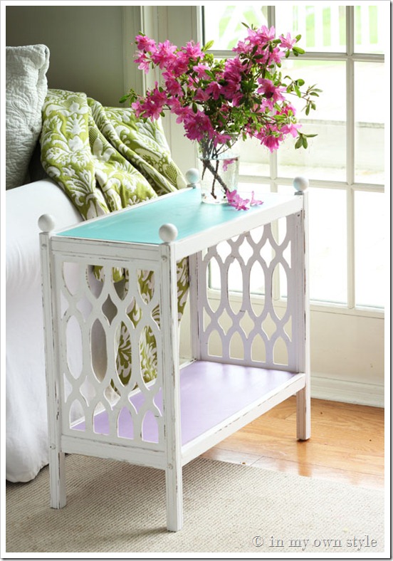 Furniture Makeover showing white painted side table with pink flowers on it.