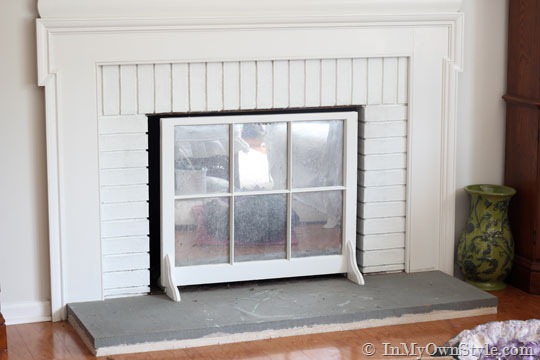 grey concrete fireplace hearth before painting