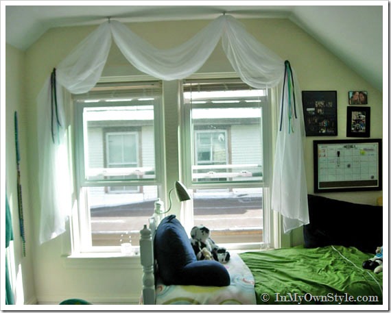 College apartment showing a creative DIY idea for a window treatment and bed.