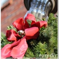 Christmas-Outdoor-Porch-Light Decoration using greenery.