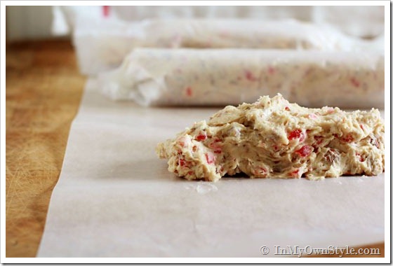 Cookie dough is rolled into logs to place in the fridge.