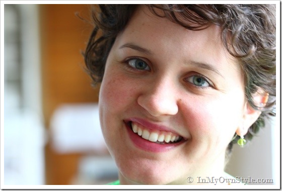Girl wearing green glass DIY drop earrings. 