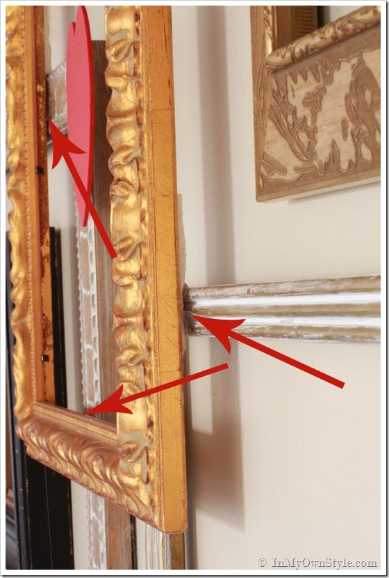 How to layer frames on a wall photo gallery