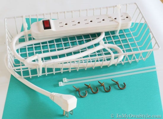 power strip in white wired basket