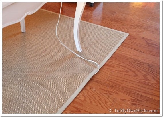 Running-an-electric-cord-under-a-rug