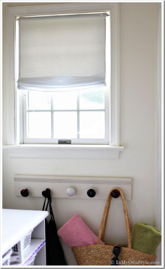 no-sew-relaxed-roman-shade hanging on window in a mudroom