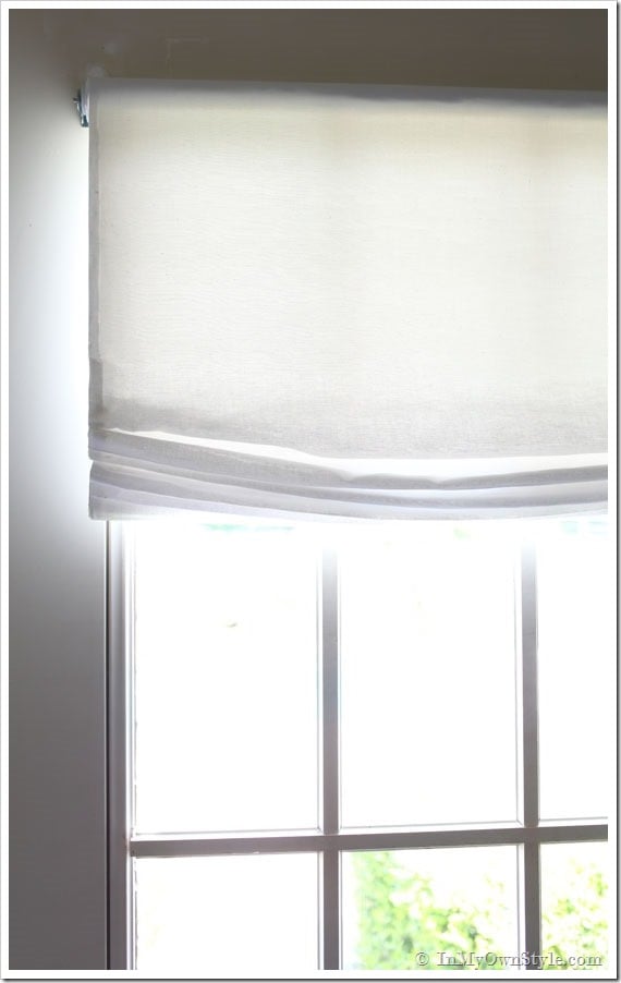 No-sew-Relaxed-Roman-shade-window-treatment hanging from a window