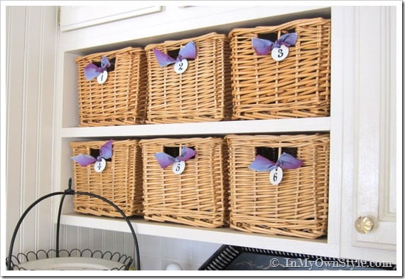 kitchen baskets on open shelves in kitchen