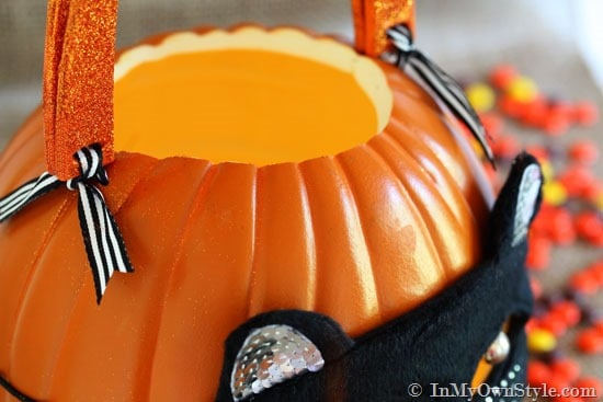 close up of ribbon ties holding handles onto pumpkin.
