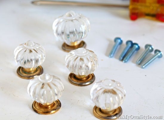 5 Cabinet knobs going to be used to make feet for a pumpkin candy jar