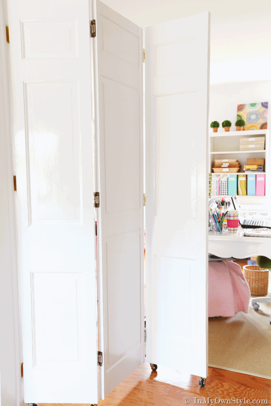 Look what you can do with bifold doors found at the thrift store. How to make a unique DIY rolling door to separate two rooms for about $30.