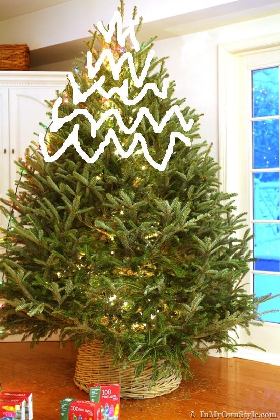 How-to-string-lights-on-a-Christmas-Tree-the-easy-way #Christmastreelightingtips #EasytoinstallChristmastreelights #BestwaytoputlightsinarealChristmastree #HowtostringlightsonaChristmastree #BestwaytolightaChristmastree #HowtoputlightsonaChristmastree #PuttinglightsonaChristmastree example of wrapping Christmas tree lights from the top
