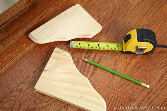 decorative wood shelf brackets made into feet to kitchen cabinets 