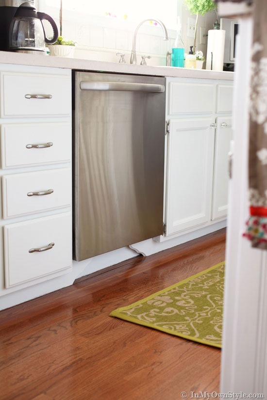 How to add decorative molding to kitchen cabinets to make them look custom made.
