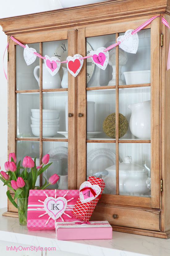 Valentine-Banner-made-using-paper-doilies on hutch.