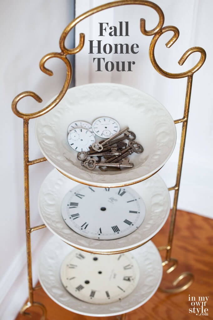 Brass 3 tier plate stand with clock faces on it for fall home decorations