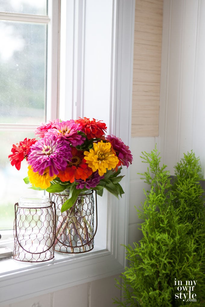Colorful autumn-flowers on a windowsill.