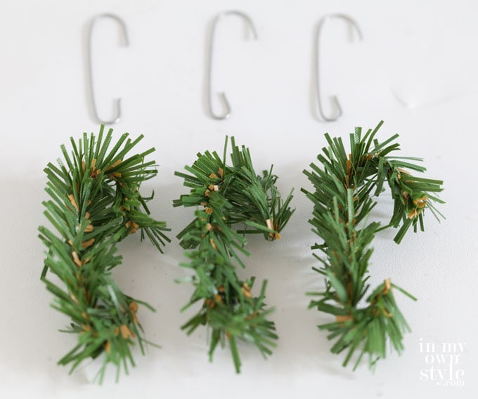 Cut pieces of a garland tie made into Christmas ornament hooks. 