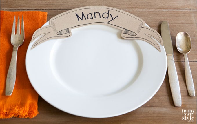 Download the free printable to make these unique paper ribbon place cards to place cards that get placed on the dinner plate