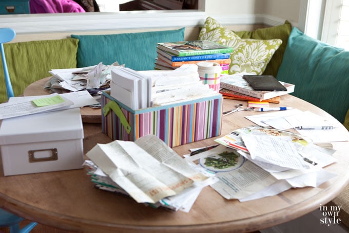 Recipe-box-organizing process on kitchen table.