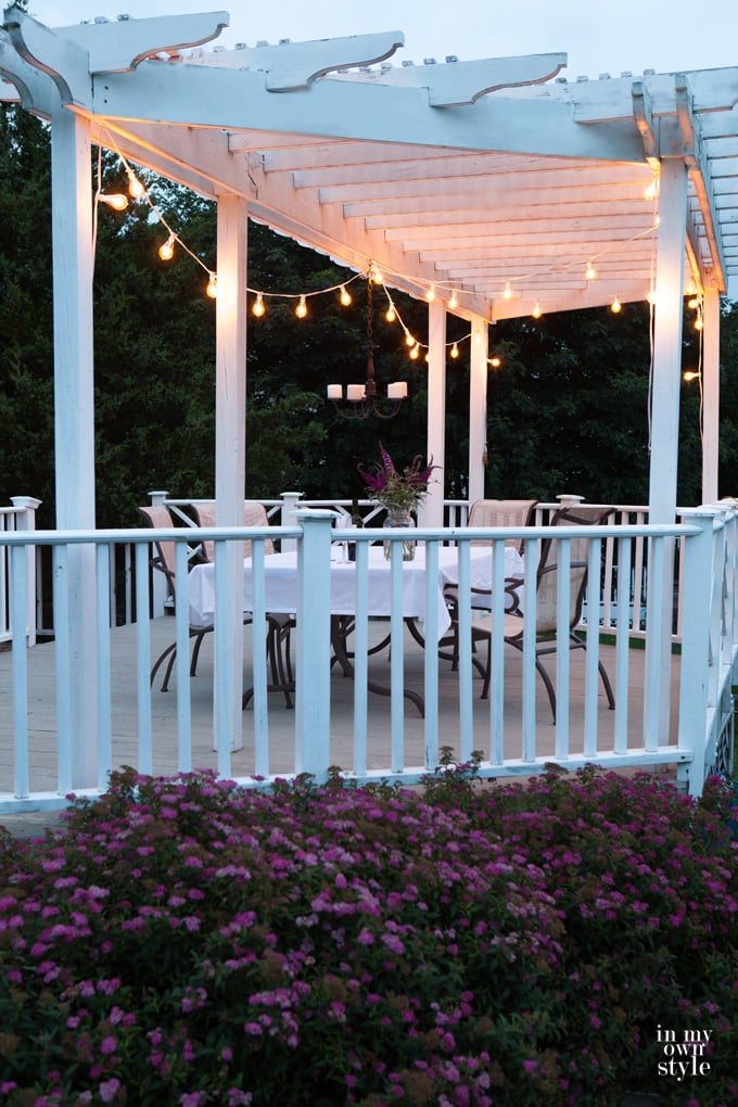 Vintage string lights on deck to dine in a soft glow of light.