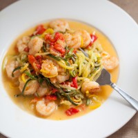 Garlic Shrimp zoodle recipe that uses zucchini and yellow squash. You won't even miss the pasta.