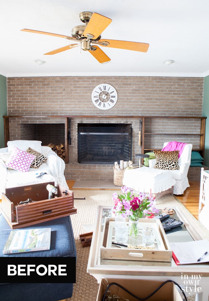 Brick wall with wood book shelves