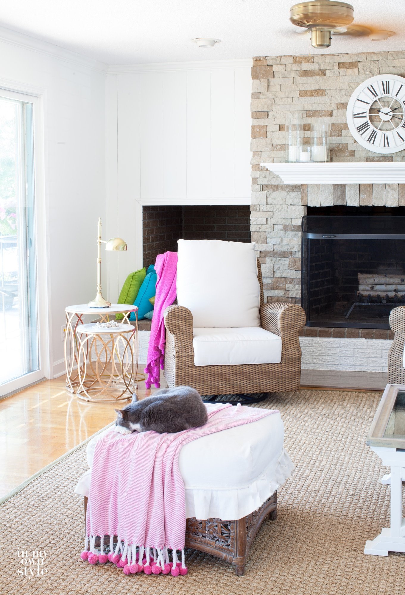 How to install vertical wood plan paneling over a brick wall and decorate with decorative throw blankets
