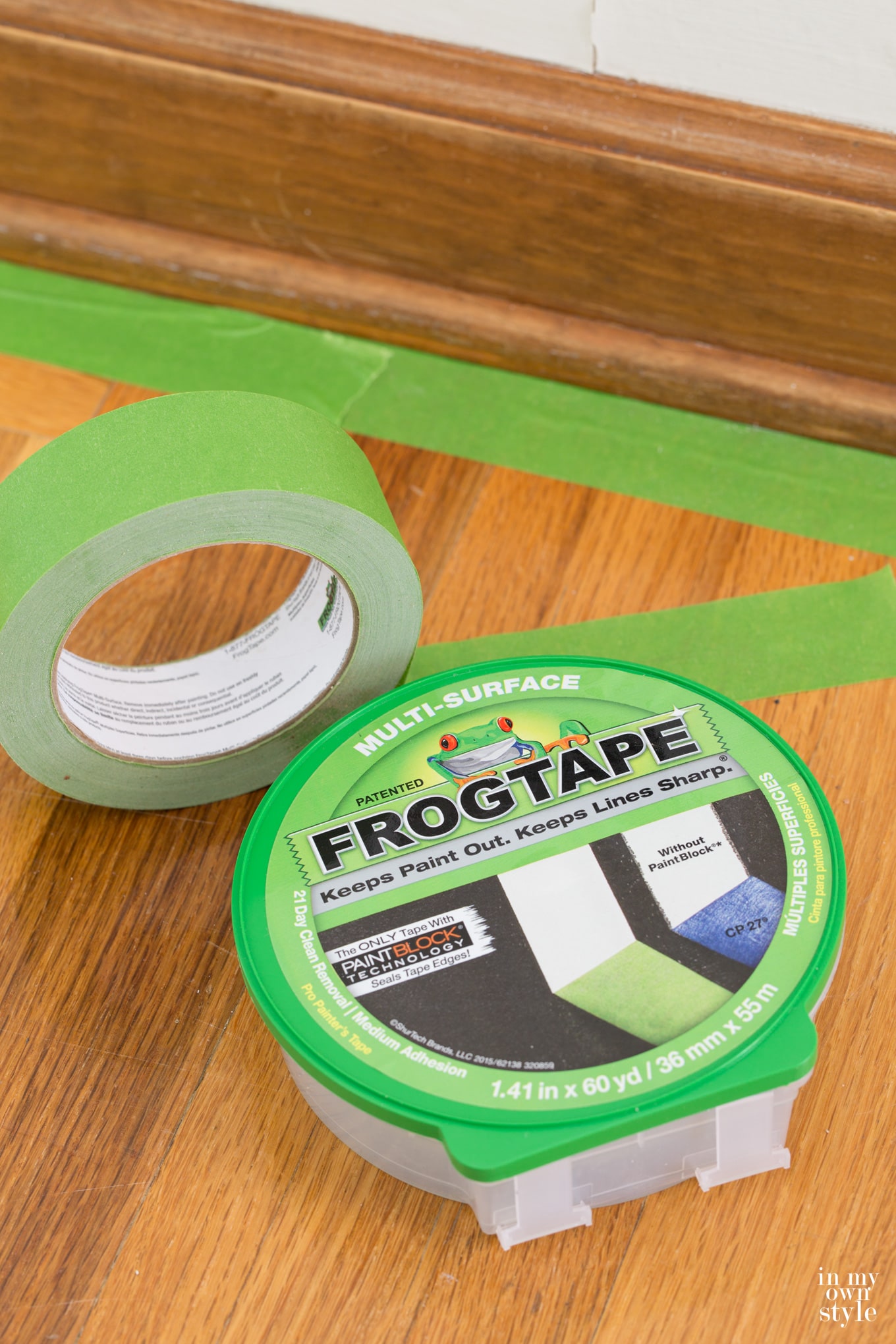 Frog-Tape used to easily paint stained trim baseboards and molding.