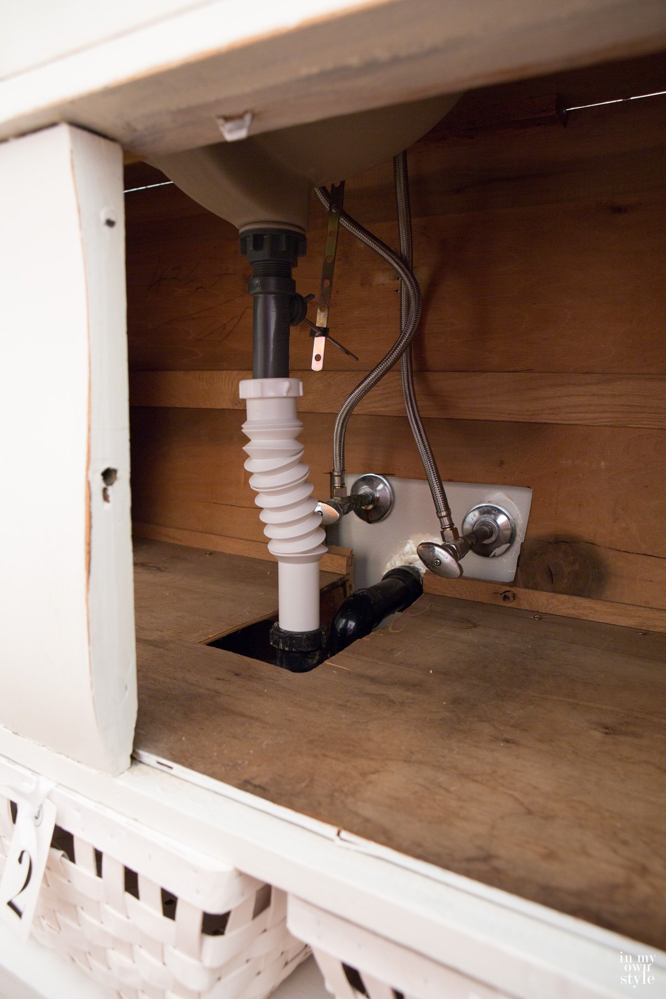 how to add the plumbing to a bathroom sink vanity made by repurposing a sideboard