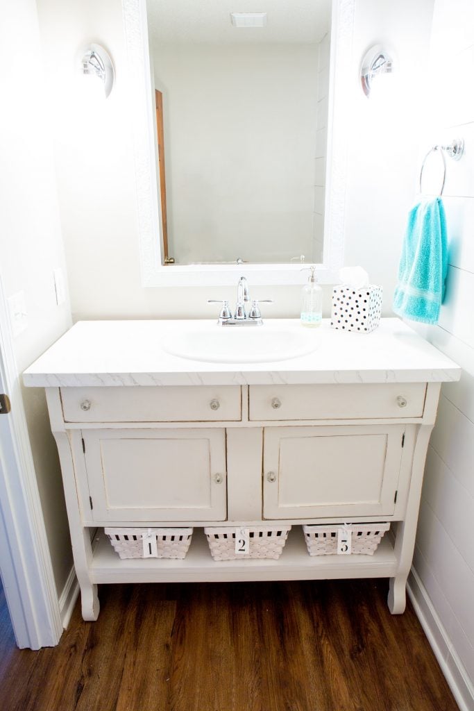 repurposed sideboard into a sink vanity for a powder room